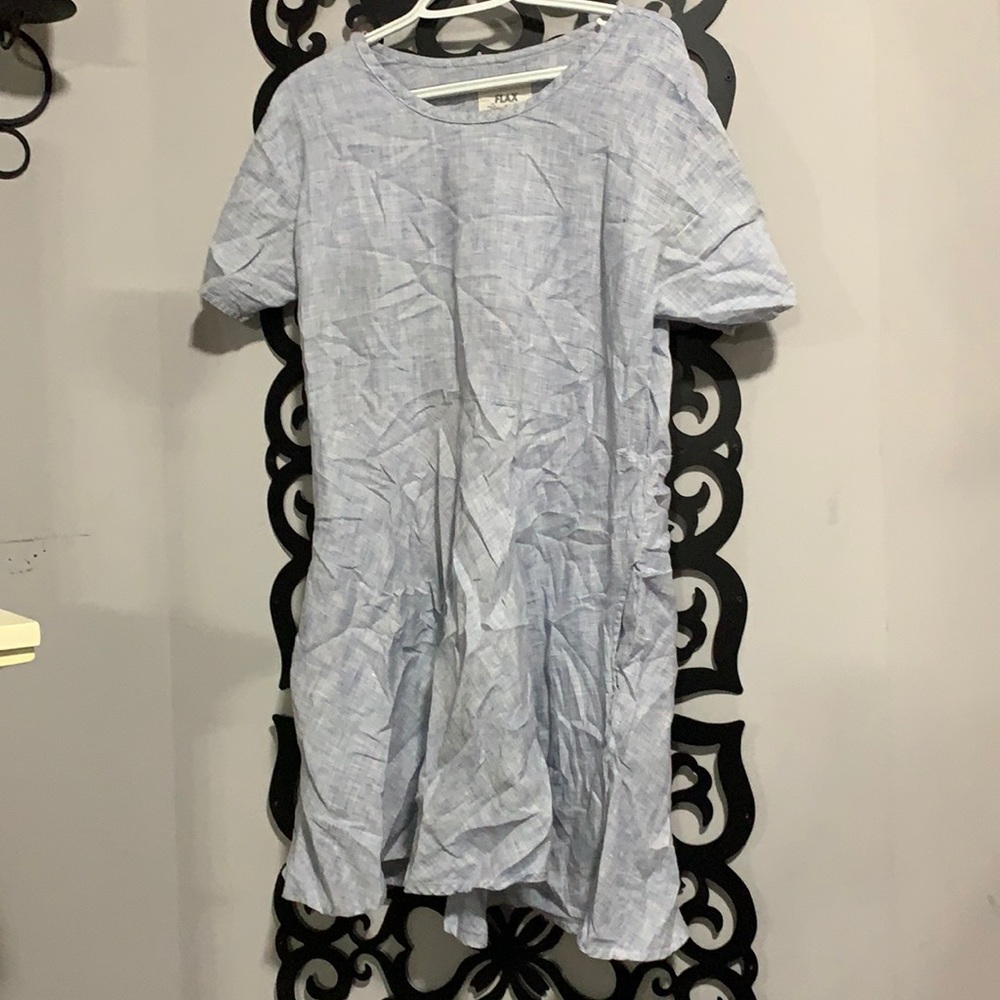 Oversized denim shirt dress with pockets.